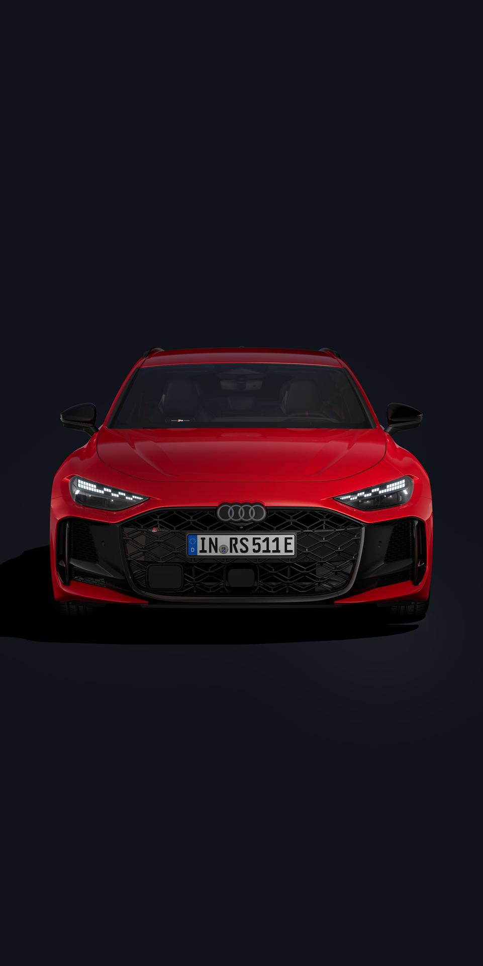 Ein roter Audi RS 5 Avant ist auf schwarzem Hintergrund abgebildet.