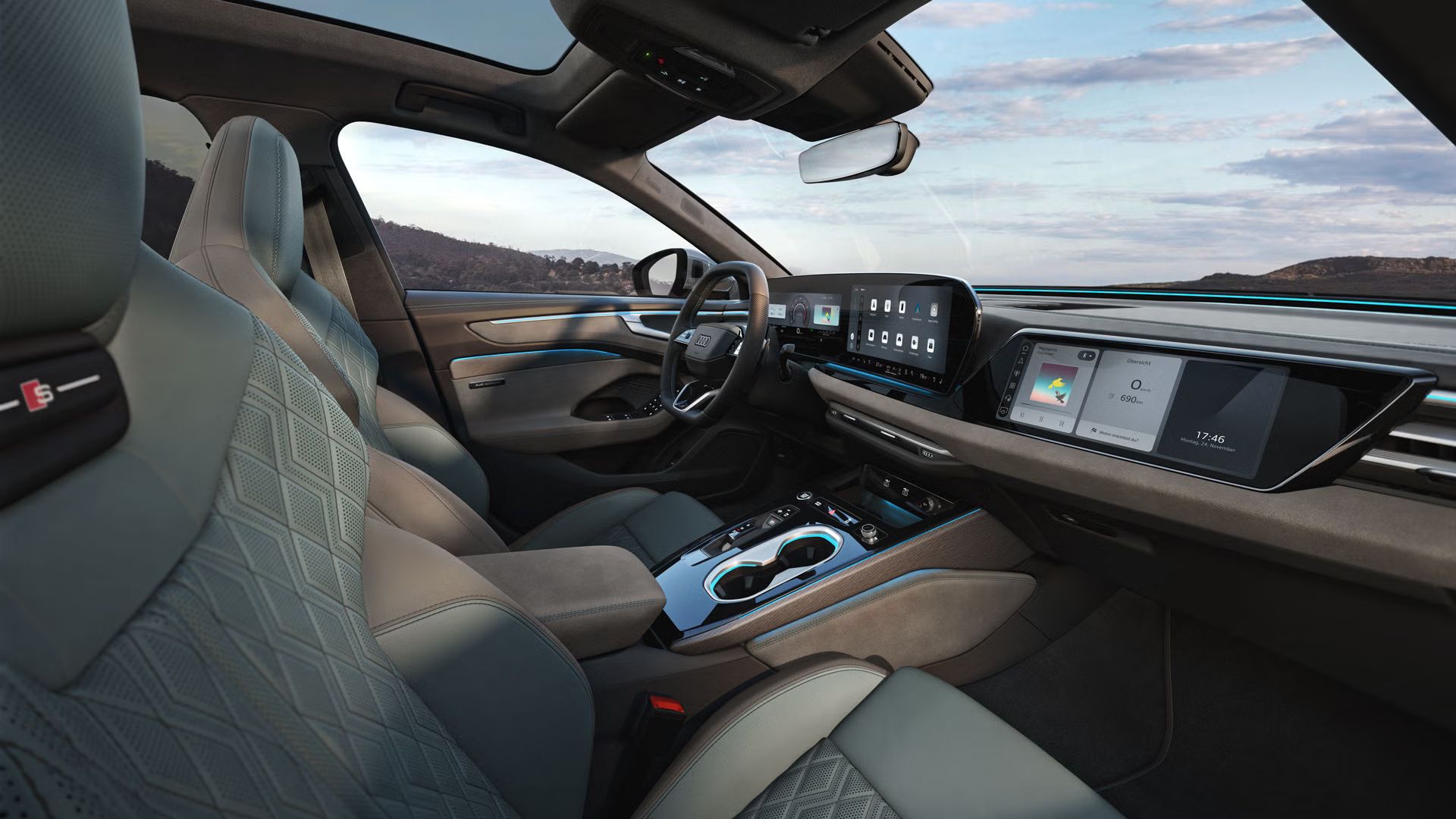 Blick durch das Beifahrerfenster in das Cockpit des A6 Avant. Das Interieur hat mintgraue Bezüge.