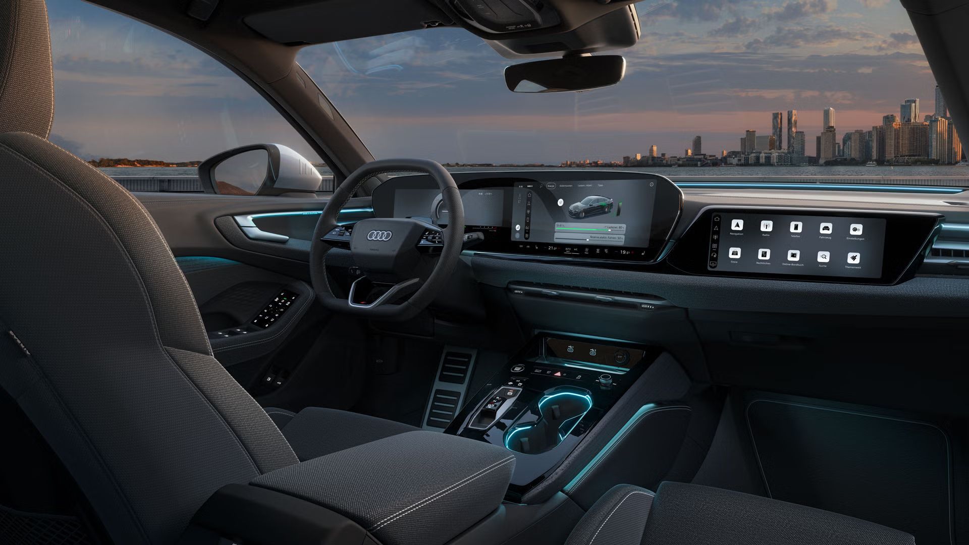 Blick in das Cockpit der A5 Limousine e-hybrid. Zu sehen sind unter anderem die Panoramadisplays und Ambiente Lichter.