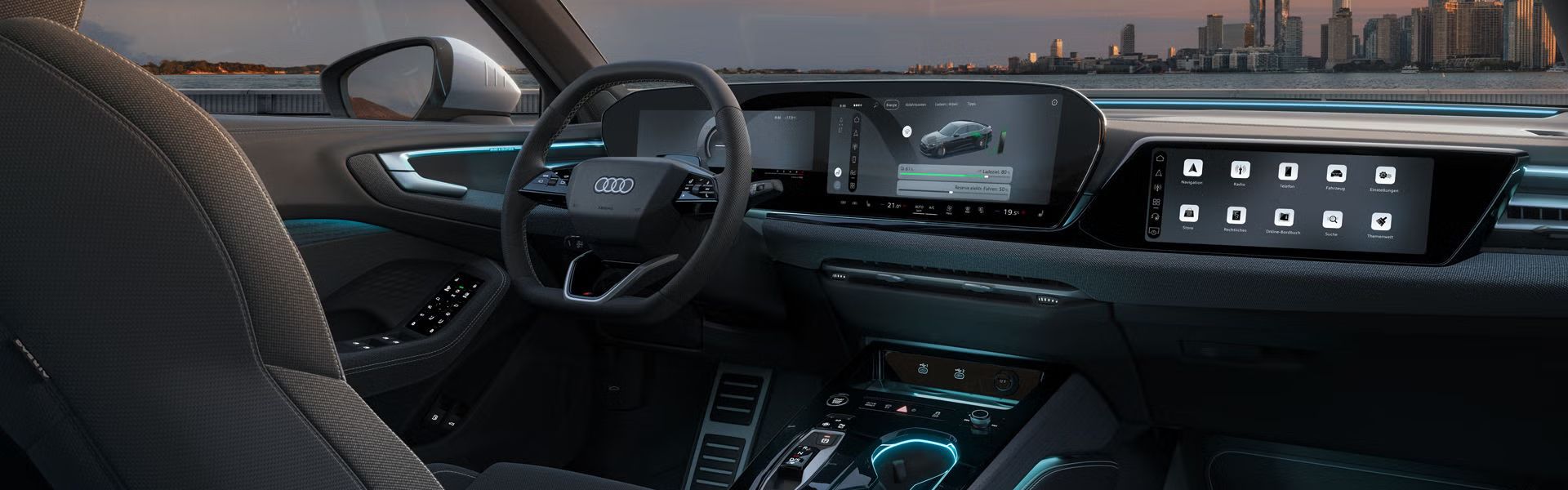 Blick in das Cockpit der A5 Limousine e-hybrid. Zu sehen sind unter anderem die Panoramadisplays und Ambiente Lichter.