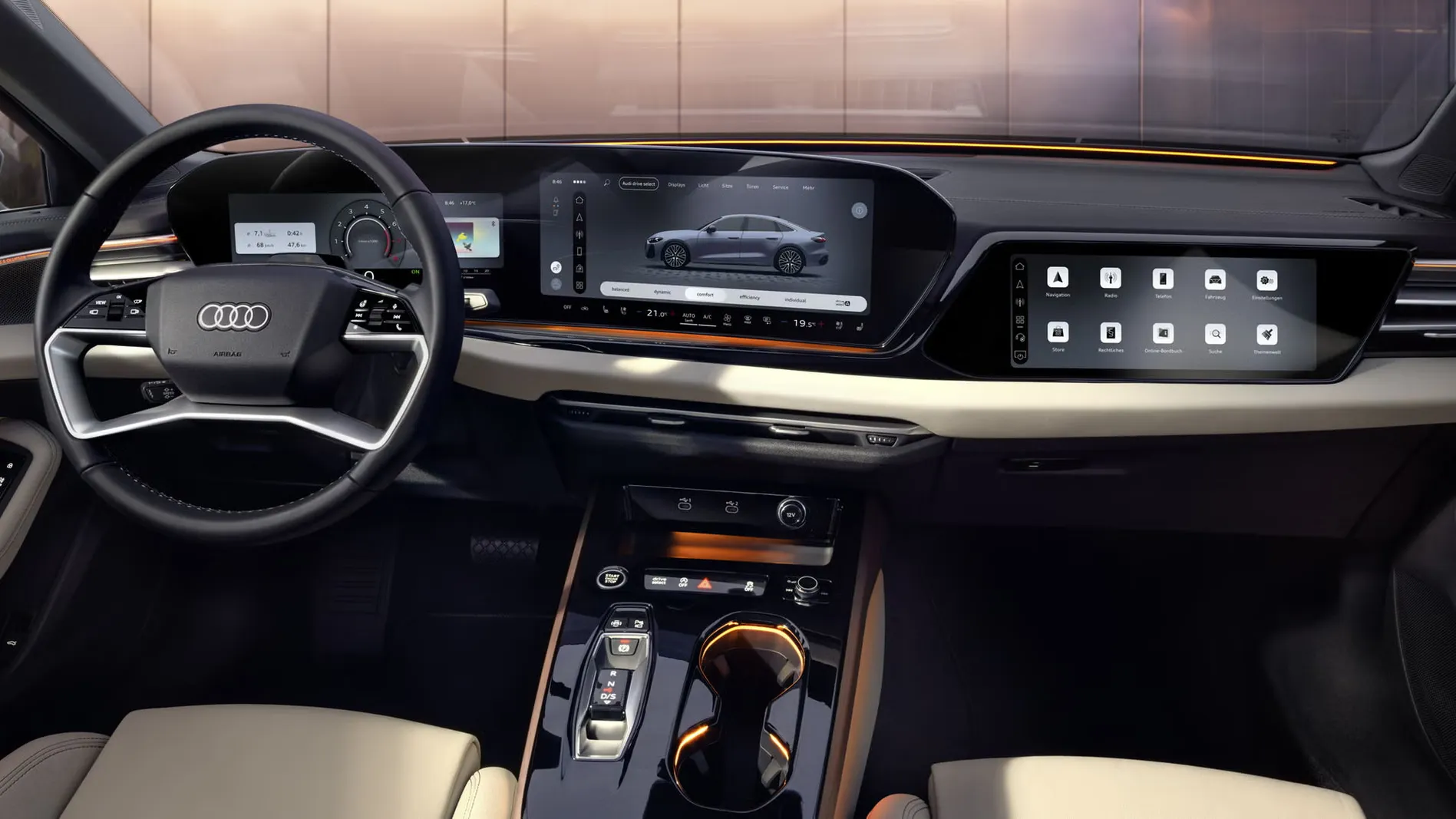 Blick von der Rückbank in das Cockpit der A5 Limousine. Zu sehen sind unter anderem die MMI Displays und das Lichtdesign mit dem Interaktionslicht am unteren Rand der Windschutzscheibe.