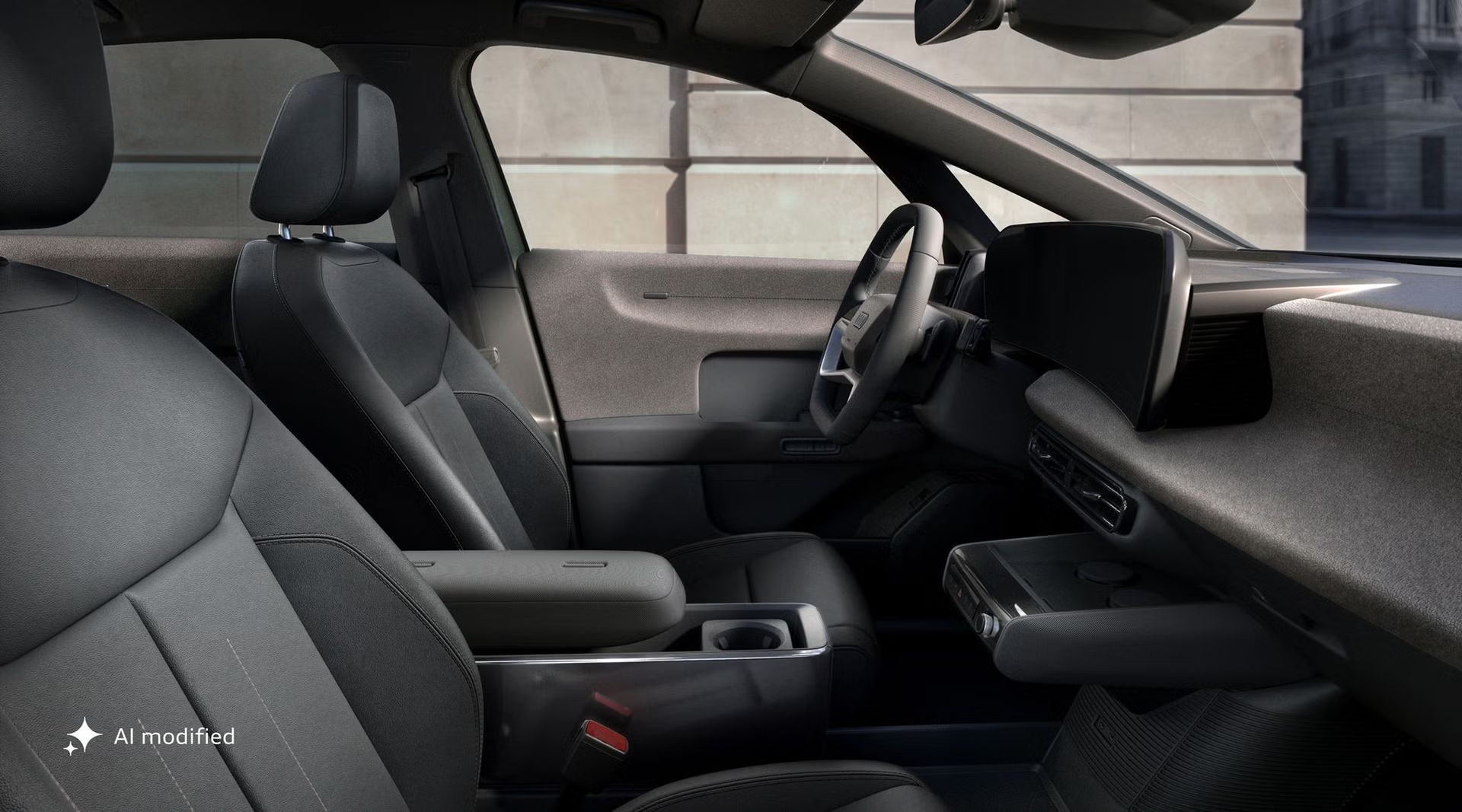 Blick von der Fahrerseite auf das Cockpit des Audi A2 e-tron mit Fokus auf Vordersitze, Lenkrad und die digitalen Displays.