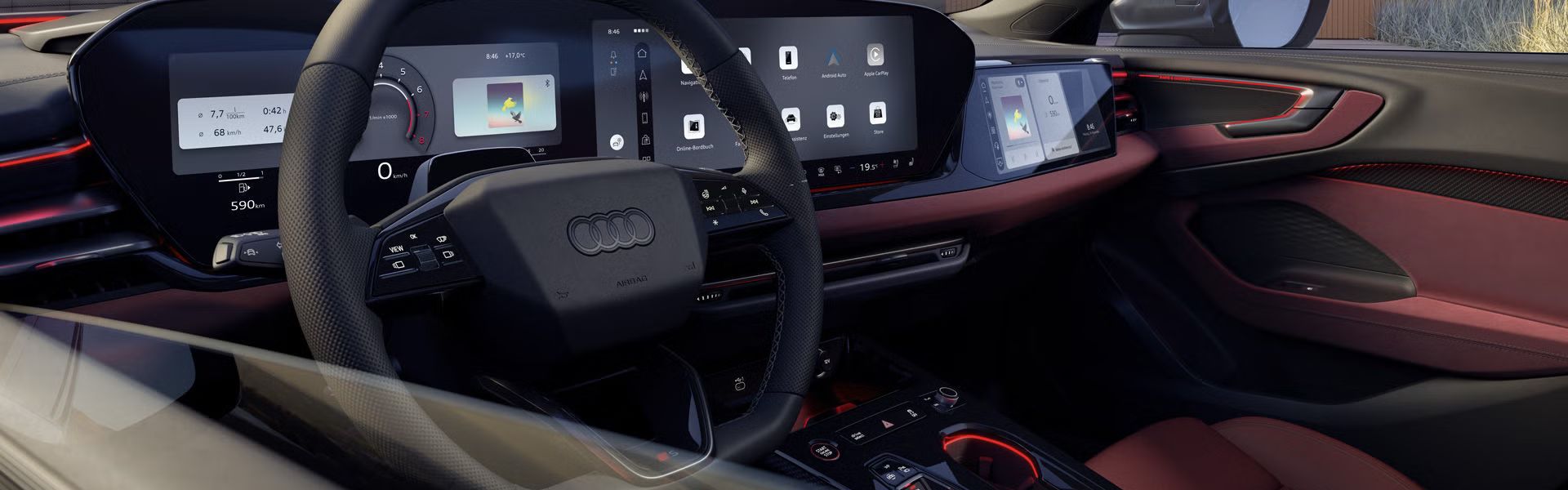 Innenraum und Cockpit des S5 Avant aus der Perspektive des Fahrerfensters. Der Innenraum leuchtet in rotem Ambiente Licht. 